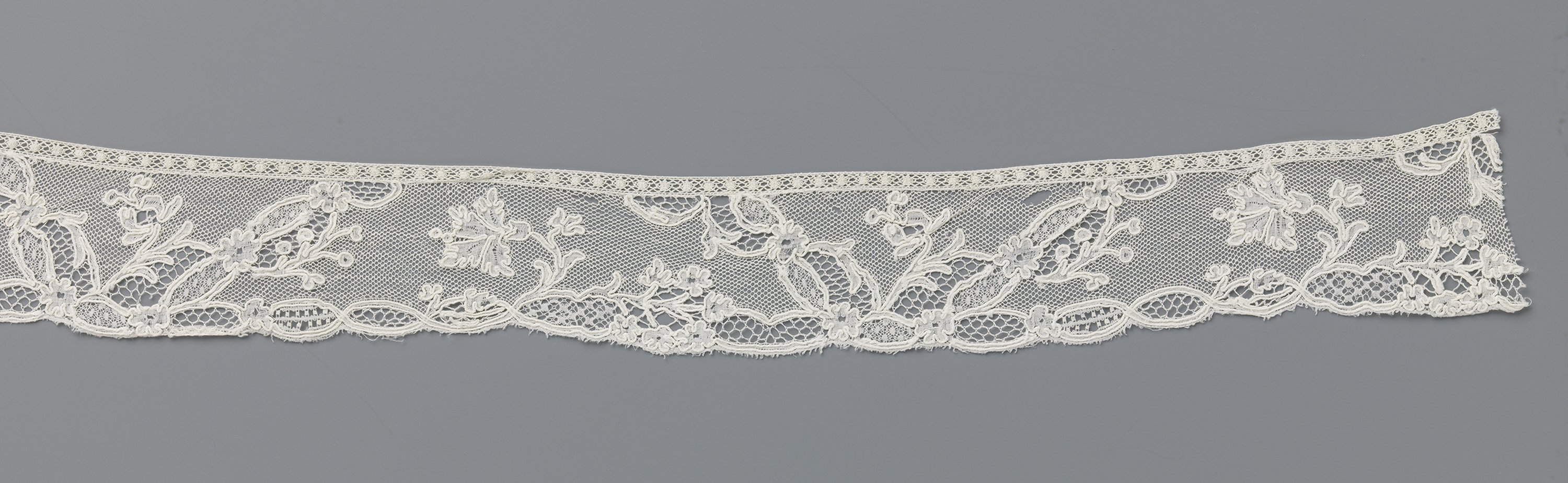 Lace artwork featuring a carnation by Unknown Artist