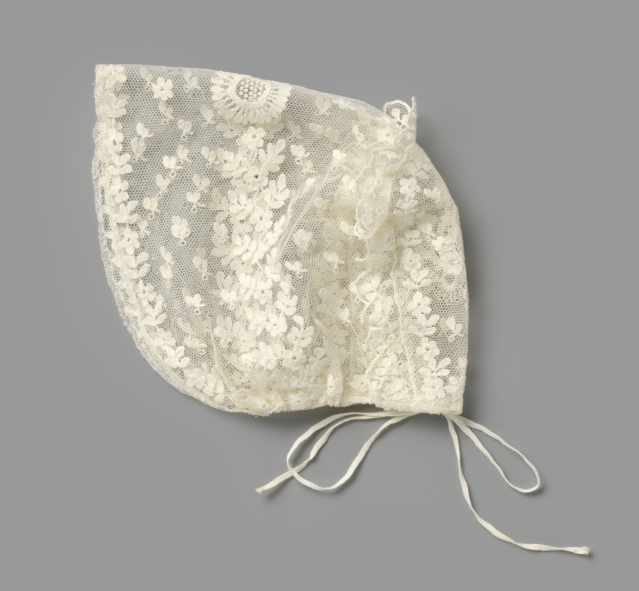 Lace cap with embroidered leaves, by Unknown Artist