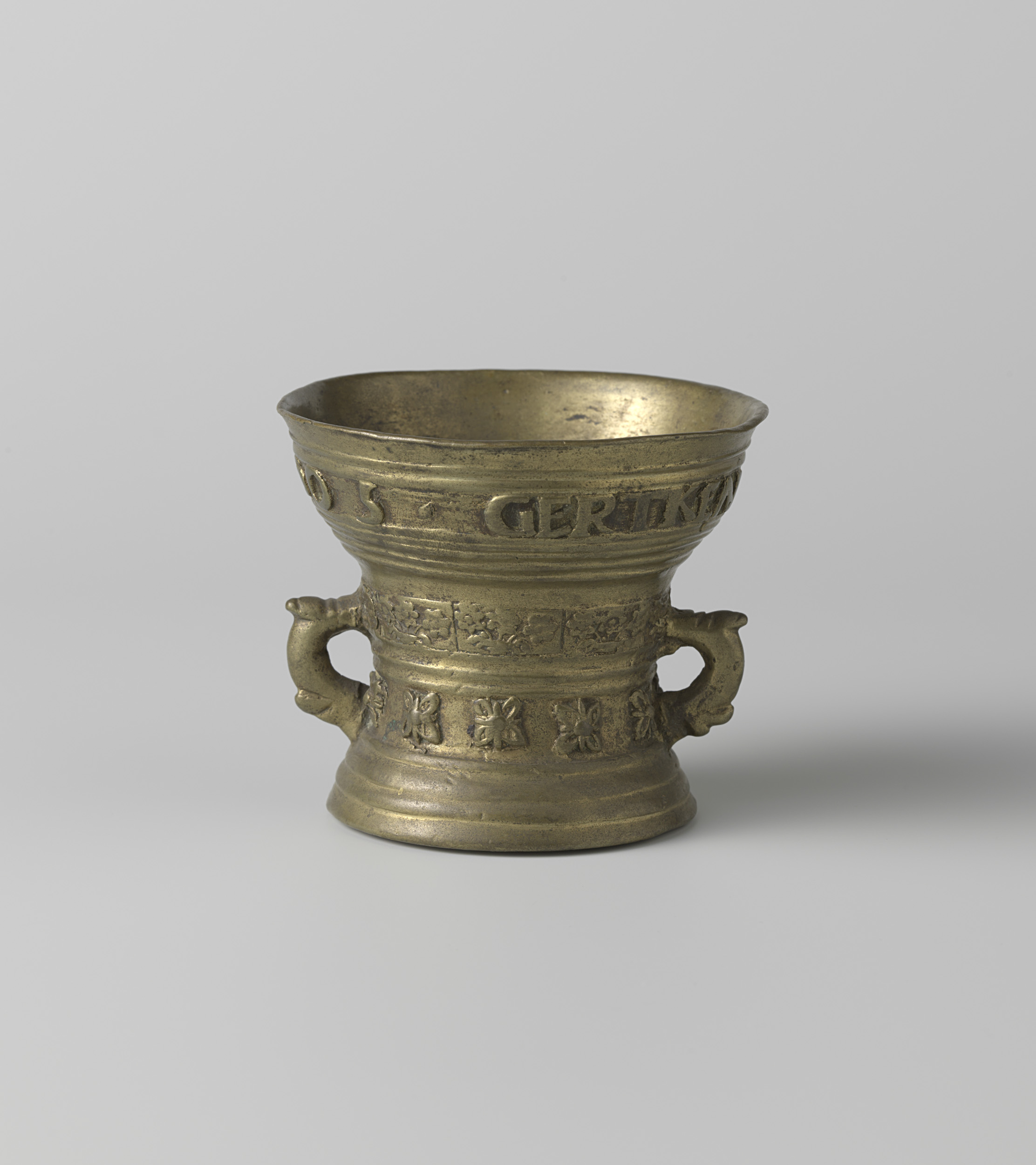 Still life featuring an intricately inscribed vessel by Hendrick Wegewart, 1605