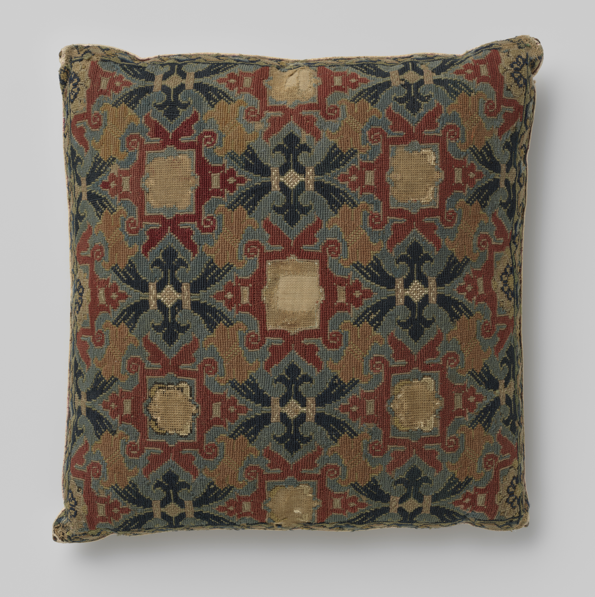 Decorative wool textile by Unknown Artist featuring intricate patterns and vibrant colors