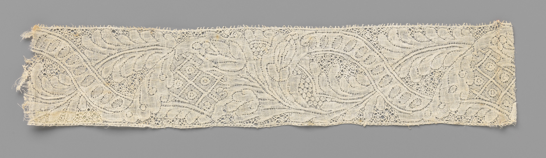 Lace textile featuring a bouquet of three flowers by Unknown Artist