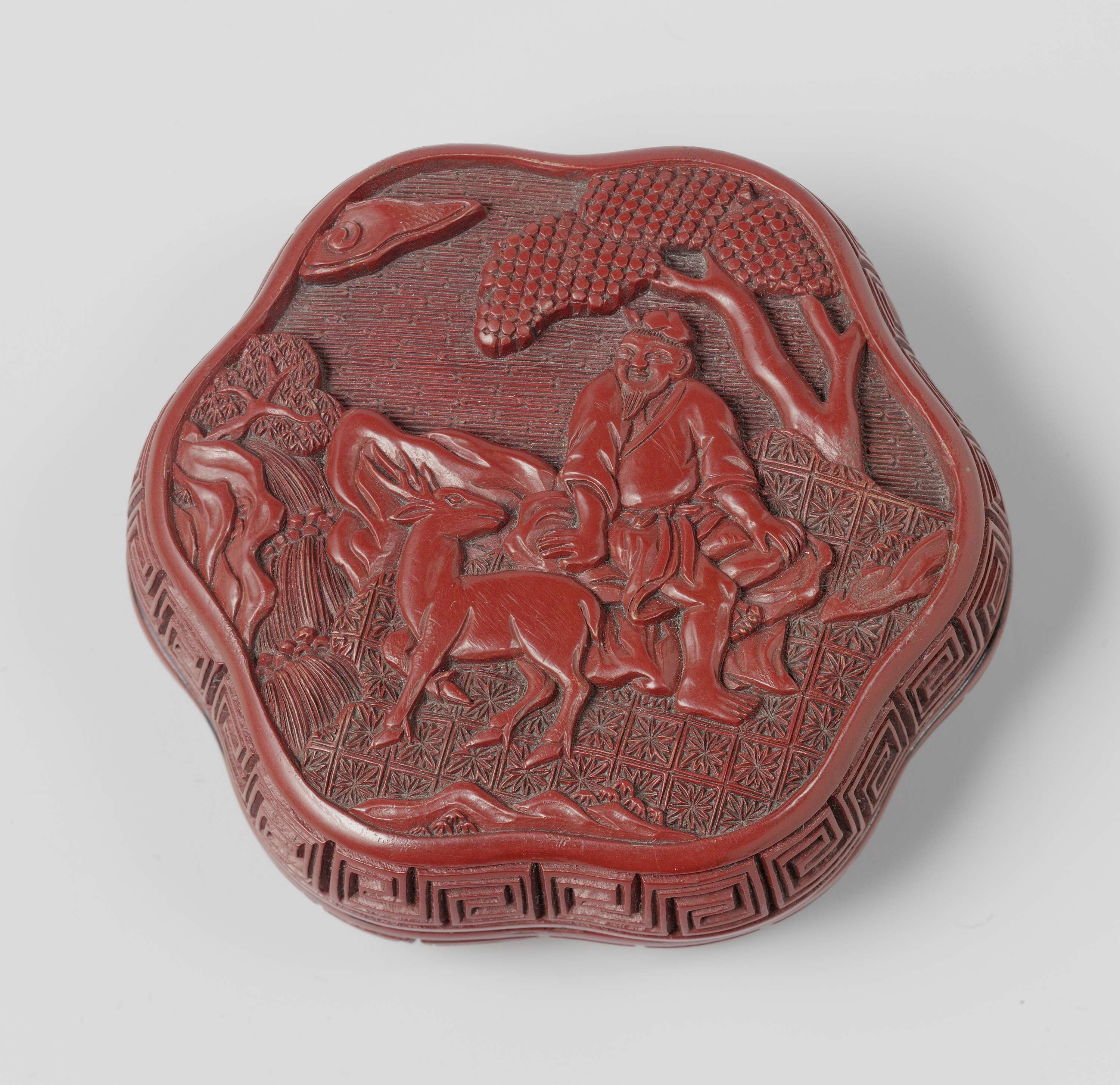 Lacquer box by unknown artist, featuring intricate details and soft lighting.
