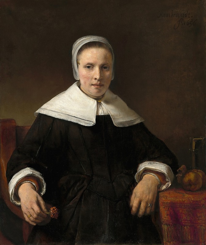 A captivating portrait of a woman holding a pink flower.