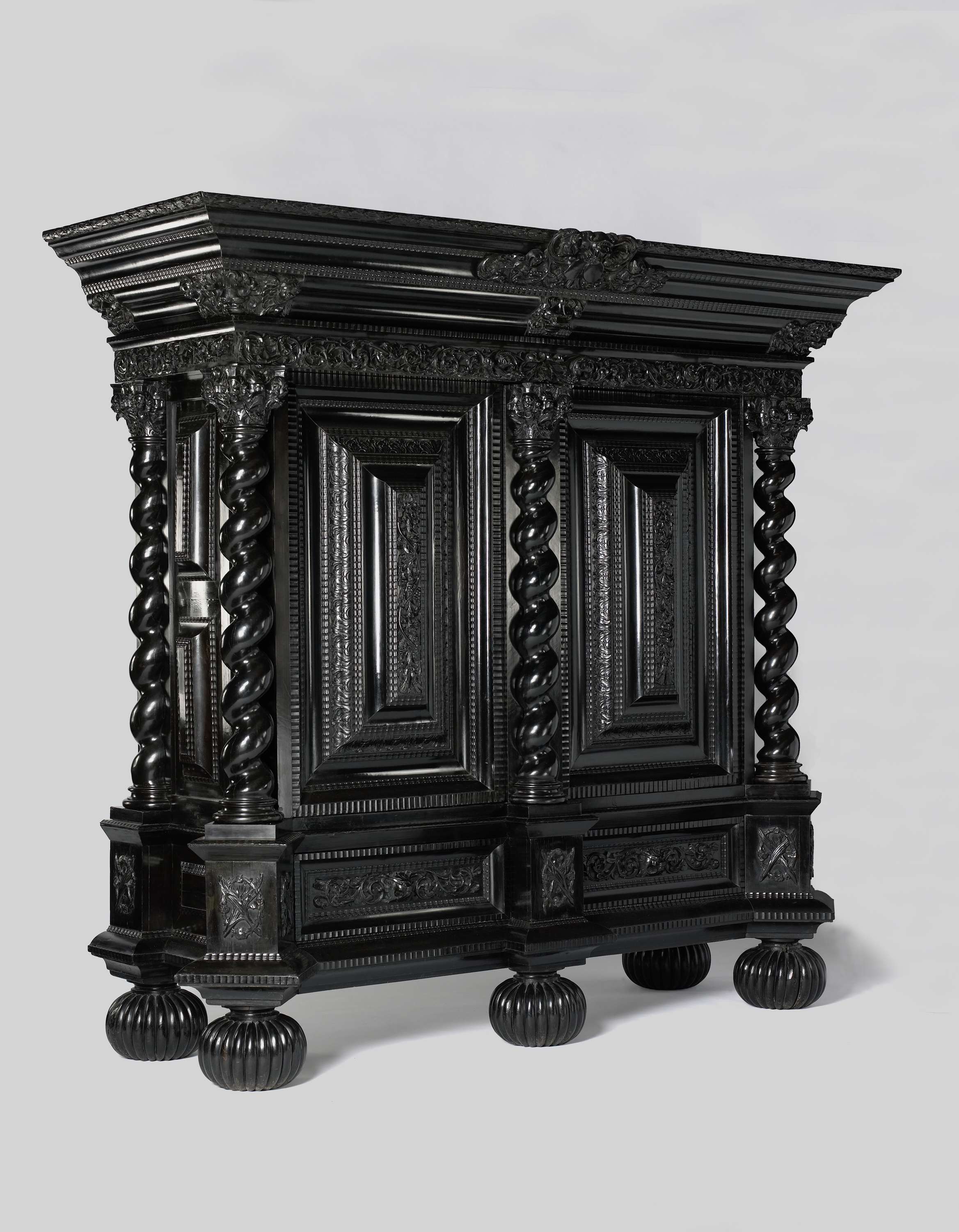 Cupboard made of wood by an unknown artist, featuring intricate ebony ornamentation.