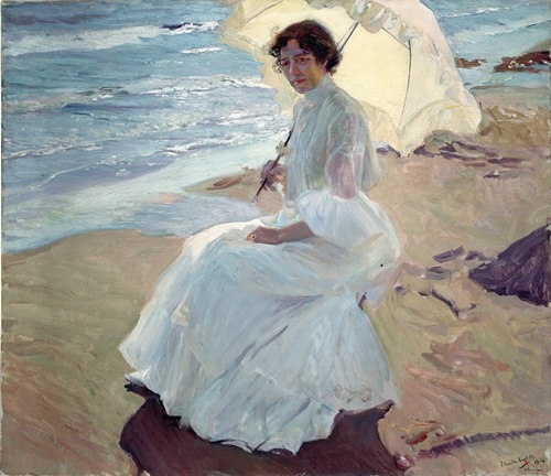 A beautiful scene of a woman named Clotilde enjoying a sunny day at the beach.