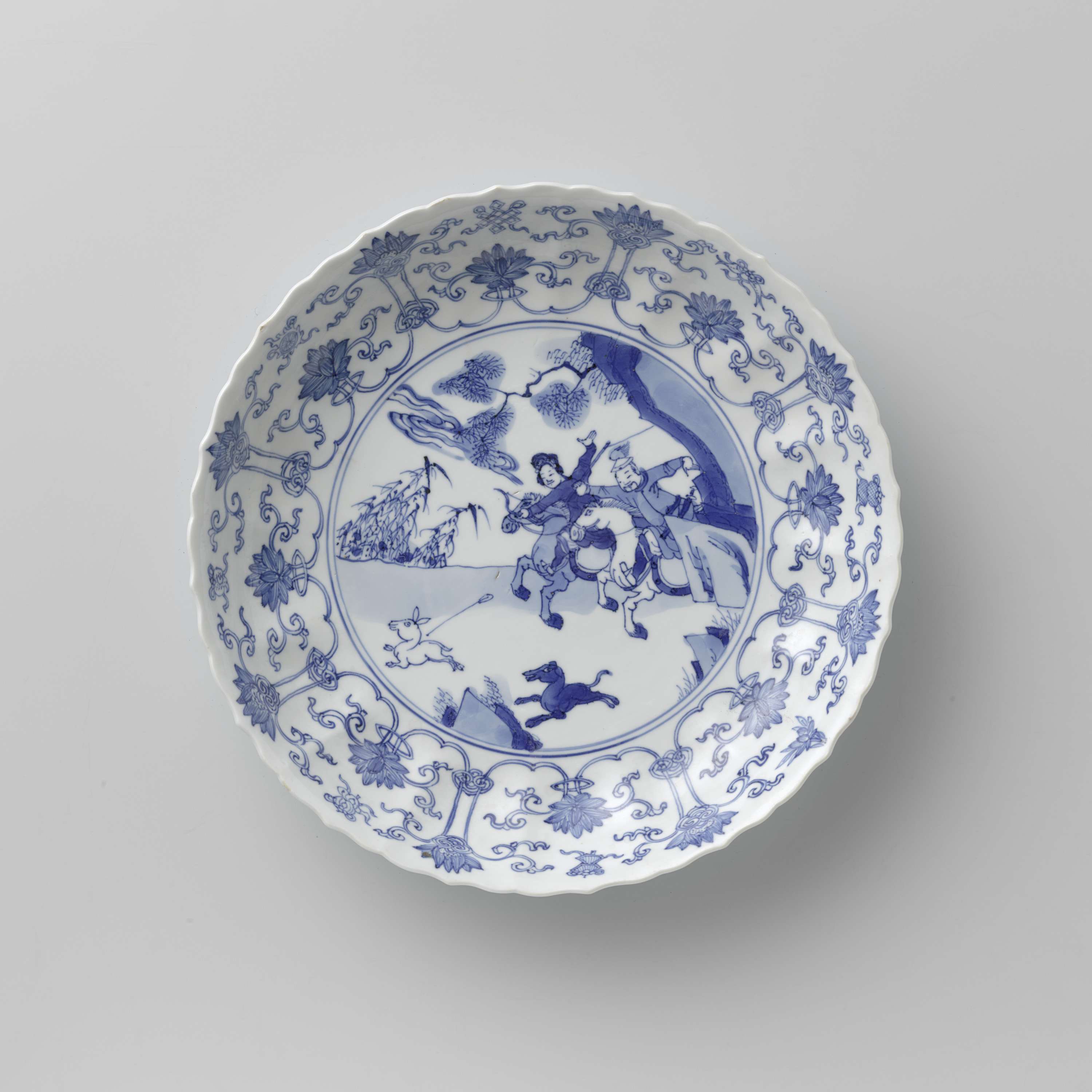 Saucer-dish with hunting scene, lotus scrolls, and auspicious symbols, Chinese Traditional