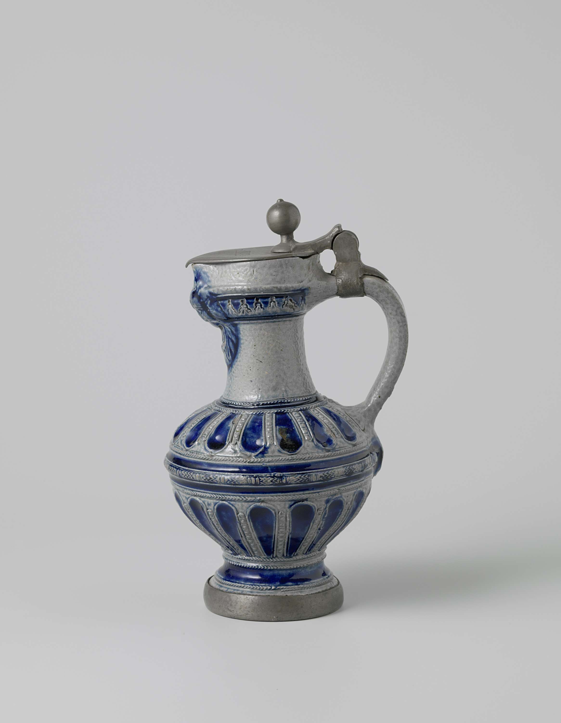 Ceramic jug with a lion's head, fluted body by Unknown Artist