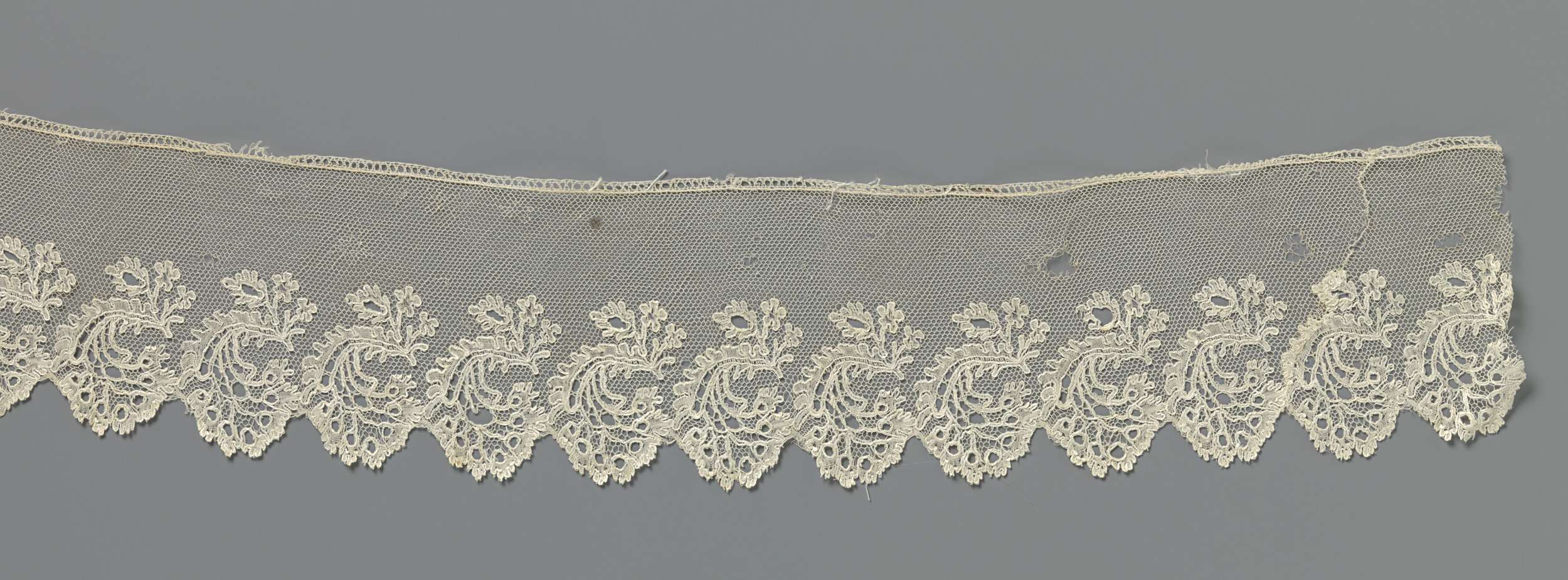 Lace artwork by Unknown Artist featuring flowers under a curved leaf