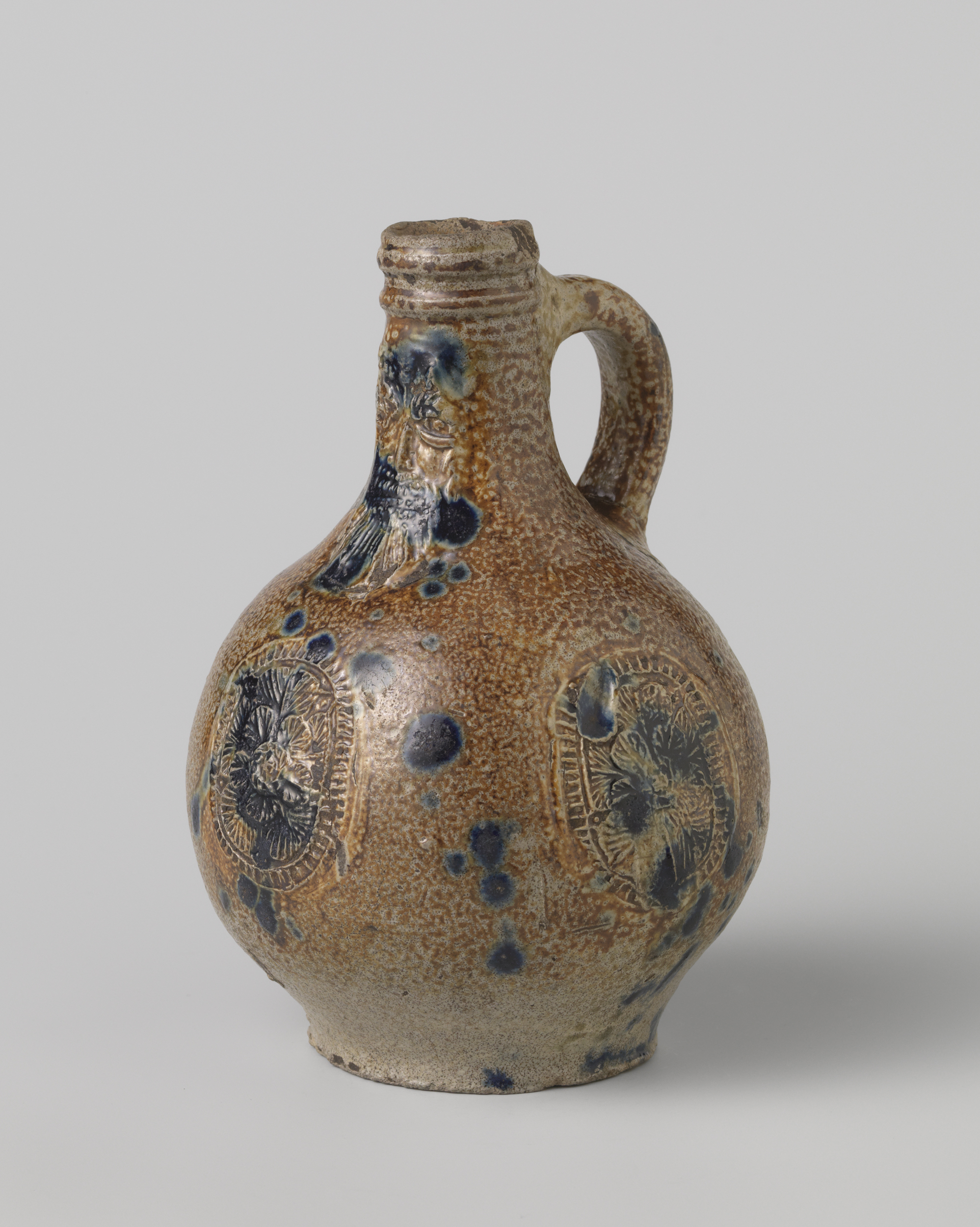 Ceramic Bartmann jug with a flower medallion by unknown artist