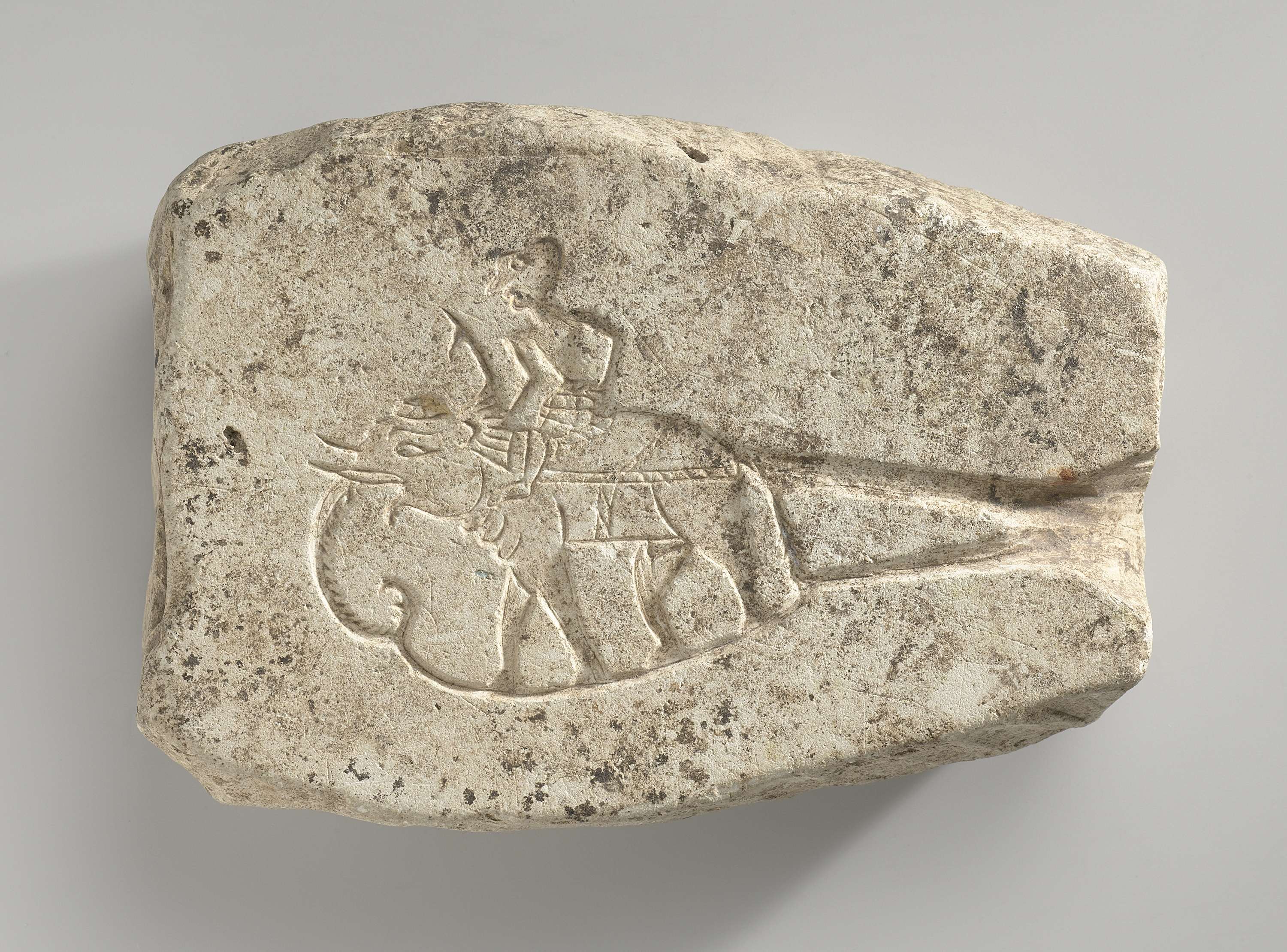 Relief sculpture of a man on an elephant and a woman on a makara, stone, Unknown Artist