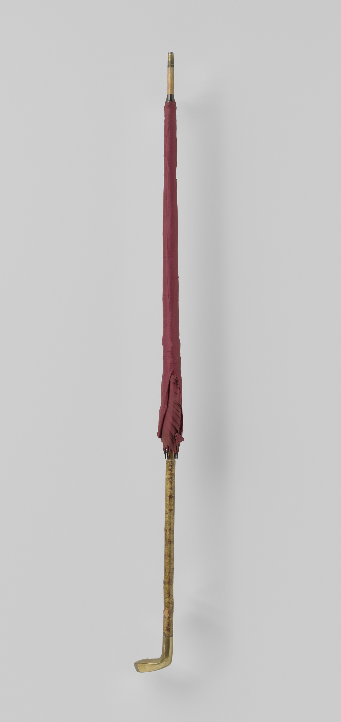 Decorative art featuring a red silk parasol with bamboo handle by Unknown Artist