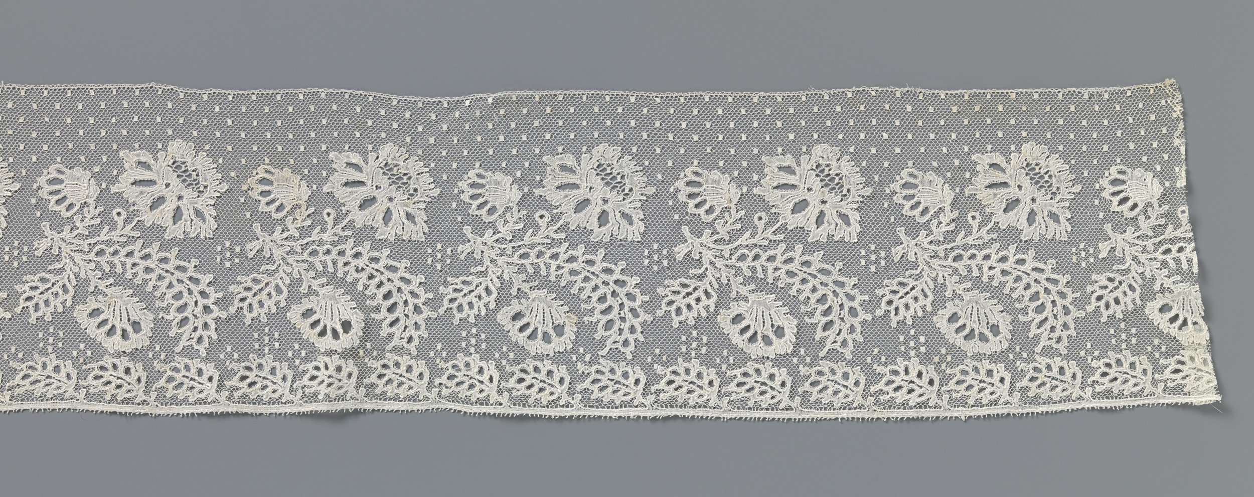 Lace artwork featuring floral arrangement by Unknown Artist