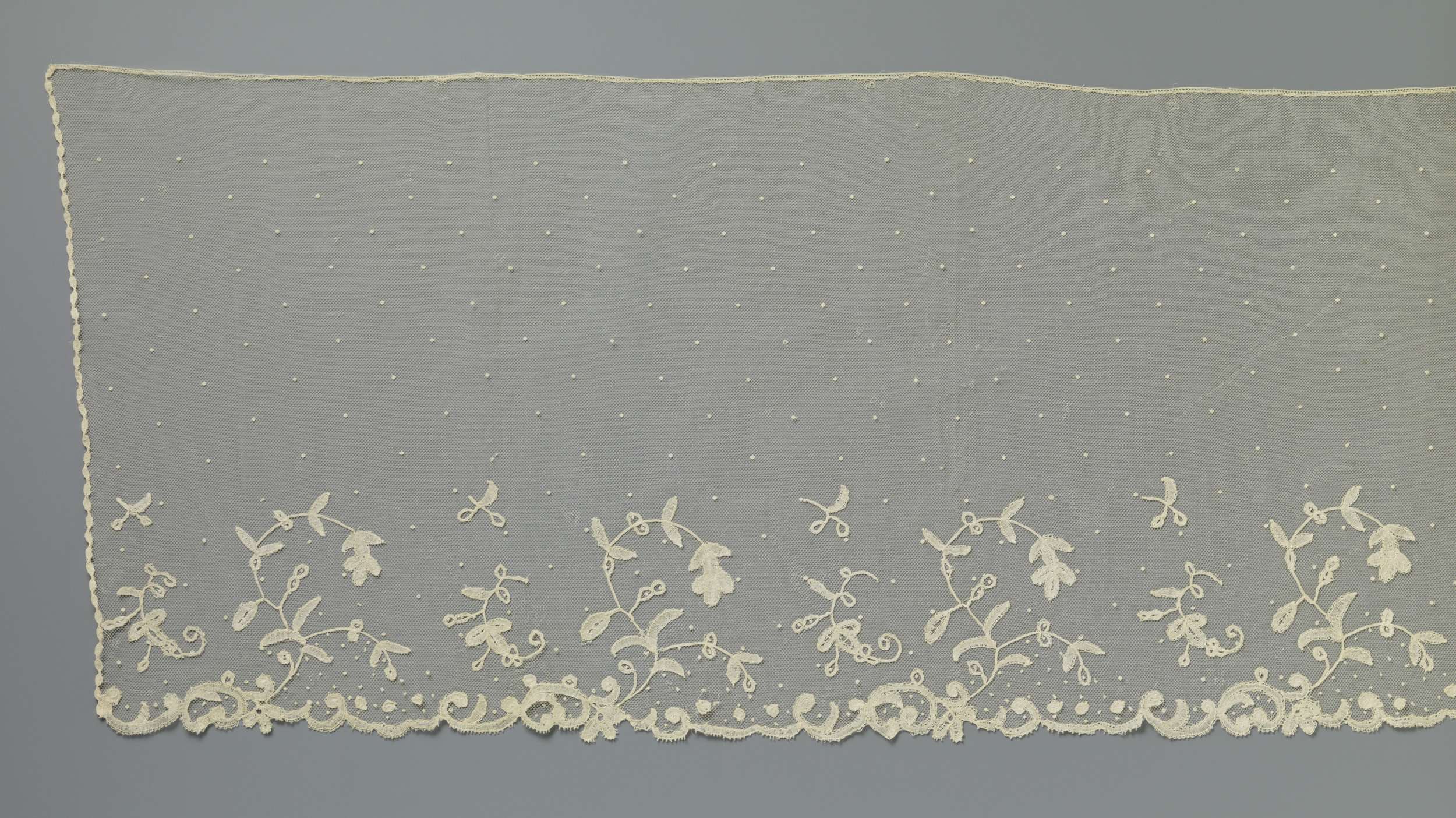 Lace textile featuring large S-shaped branches by Unknown Artist