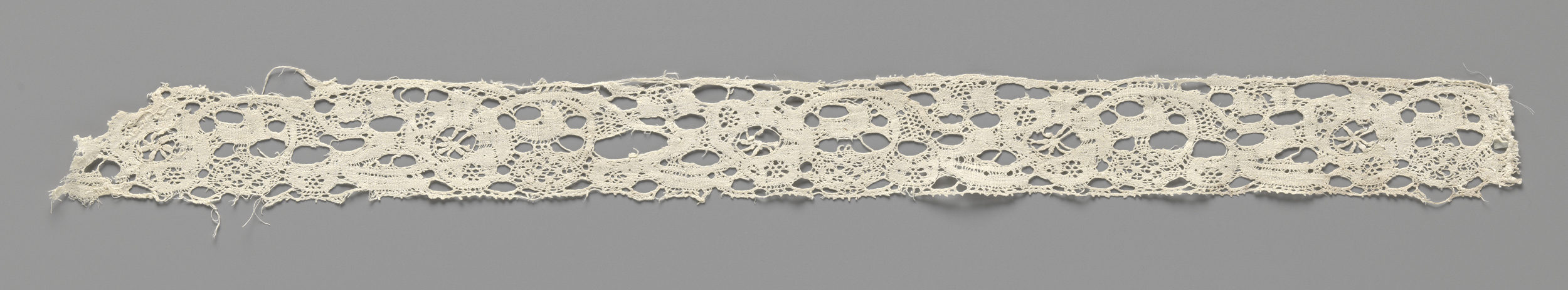 Lace work by Unknown Artist featuring floral patterns and intricate details.