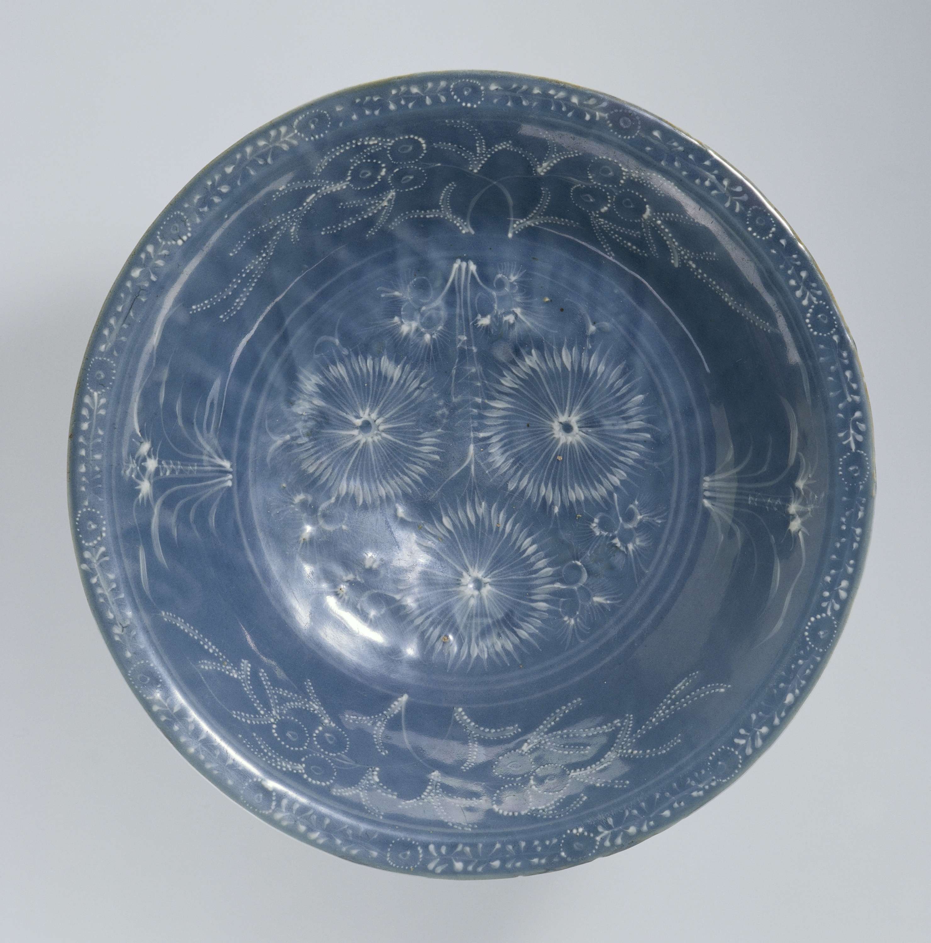 Dish decorated with blue glaze and white slip flowers, Chinese Traditional, unknown artist