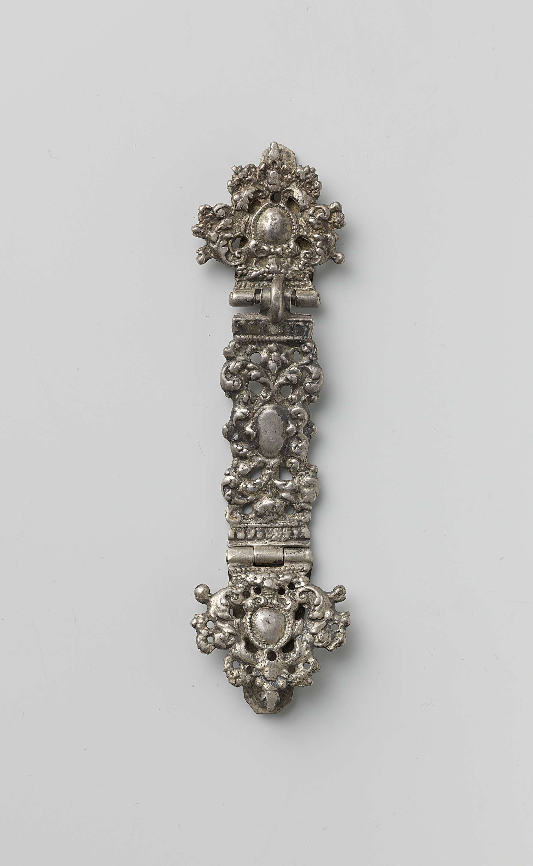 Decorative silver metalwork by Unknown Artist, featuring intricate engravings and textures.