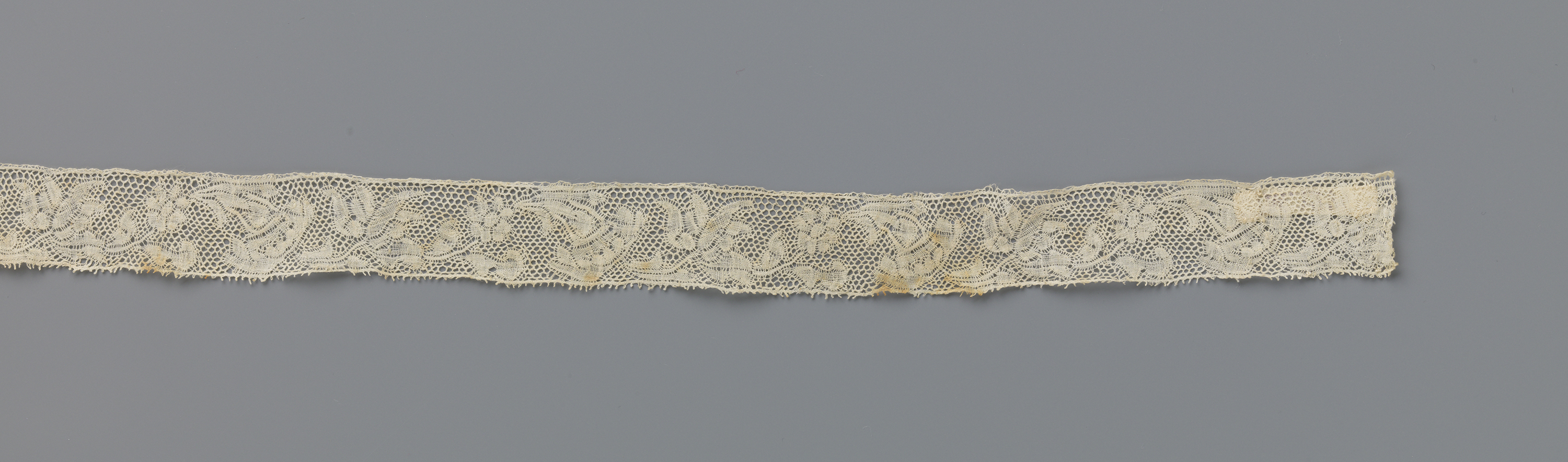 Delicate lace textile featuring floral patterns by Unknown Artist