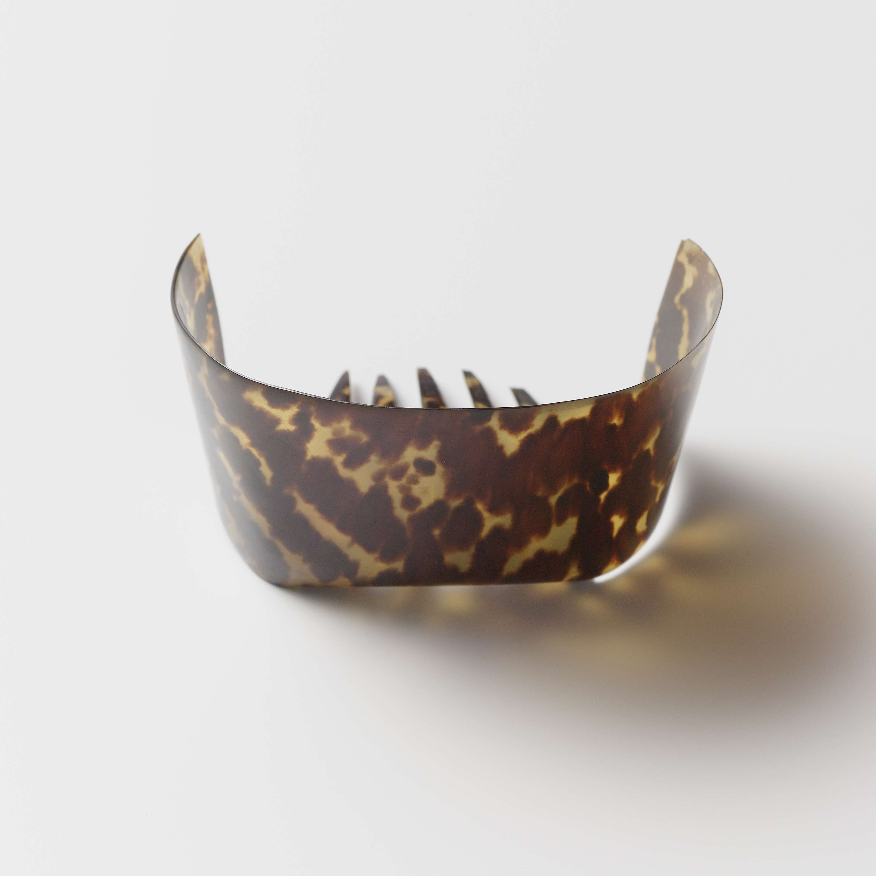 Victorian decorative hair comb made of imitation tortoiseshell by Unknown Artist
