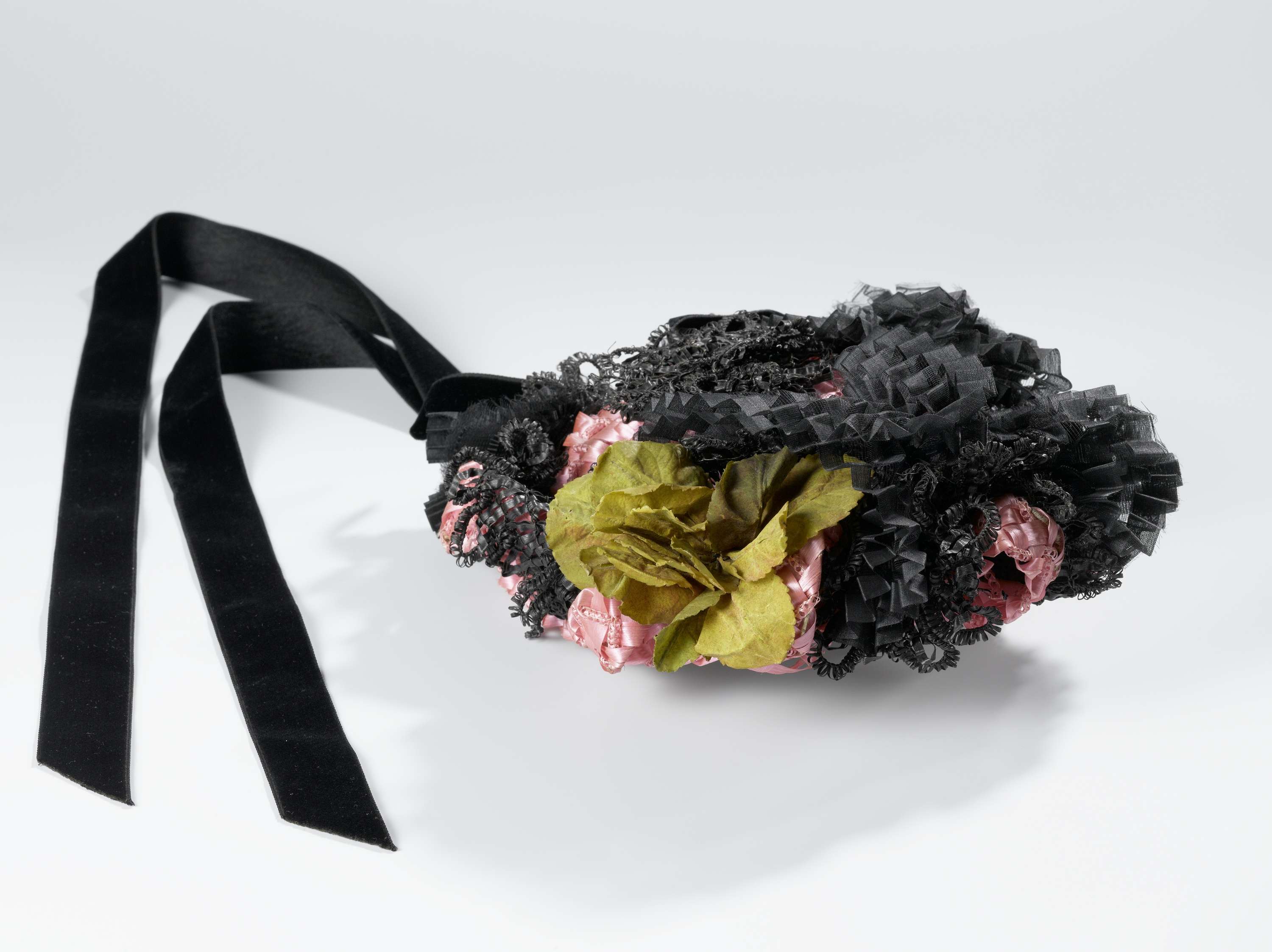 Decorative art featuring a pink hat with black ribbons and a green flower by P. Mars & Co.
