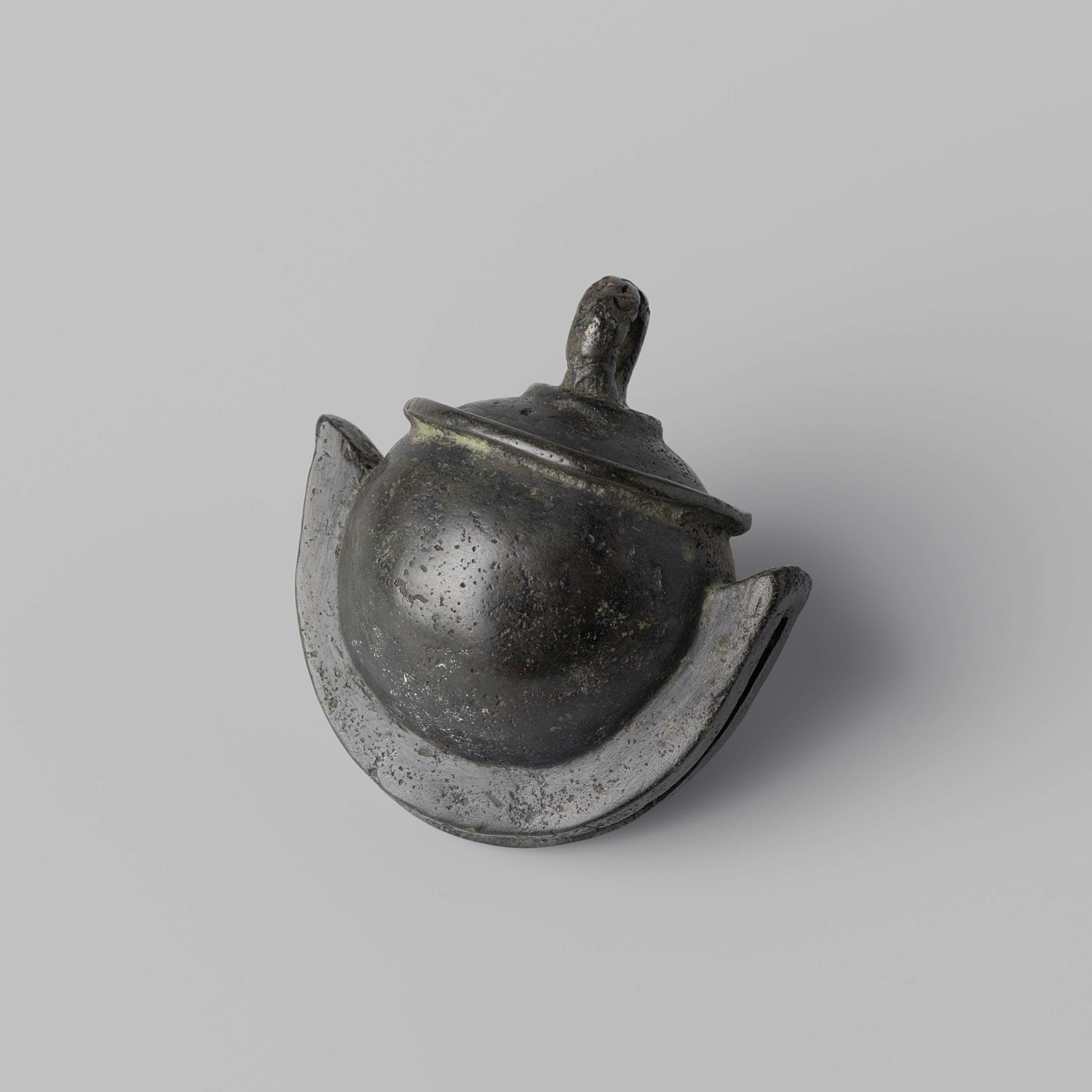Bronze bell by Unknown Artist, showcasing intricate design and craftsmanship.