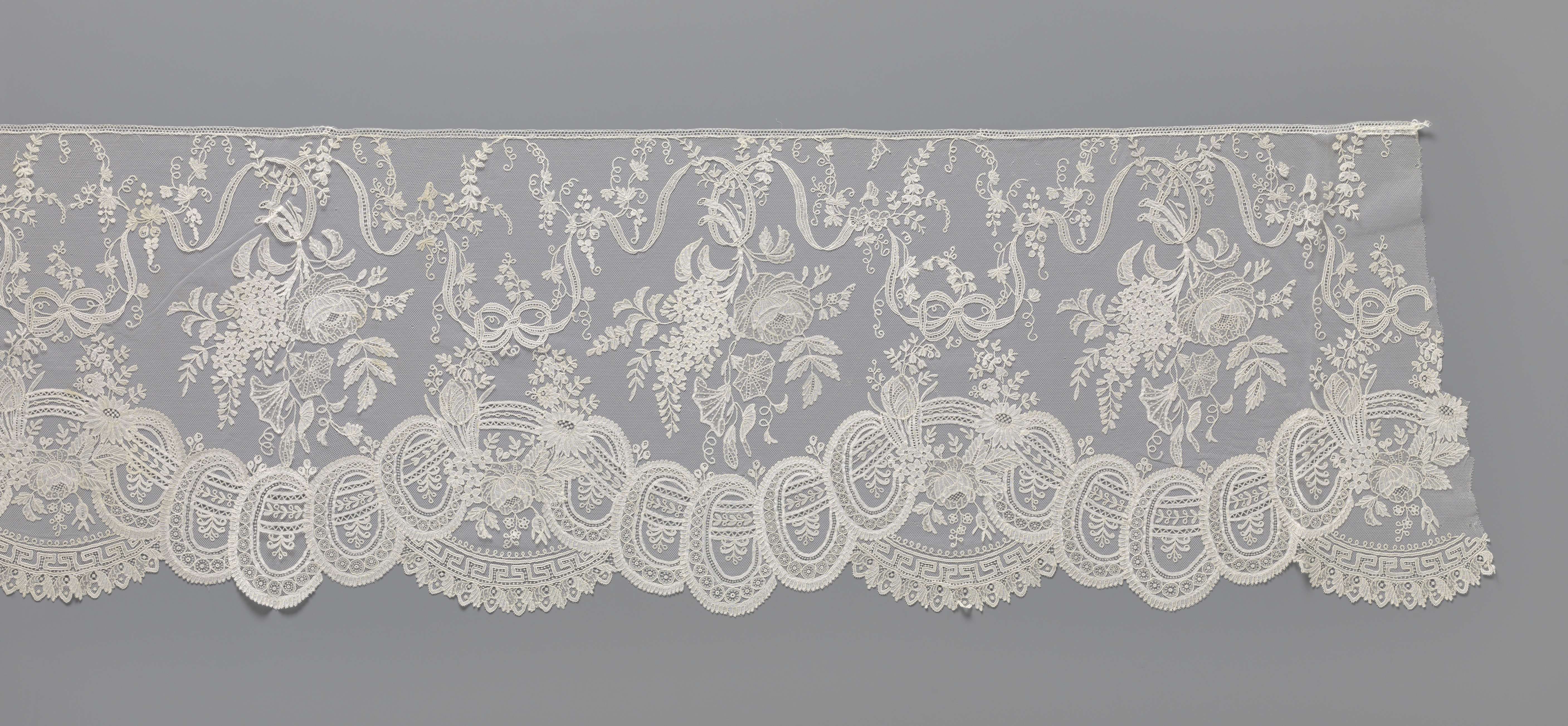 Lace textile with ribbons and intricate patterns by Unknown Artist