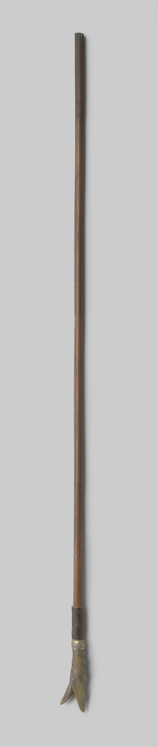 Decorative art piece by Gustav Schnitzler, featuring a parasol handle made of wood and silver.
