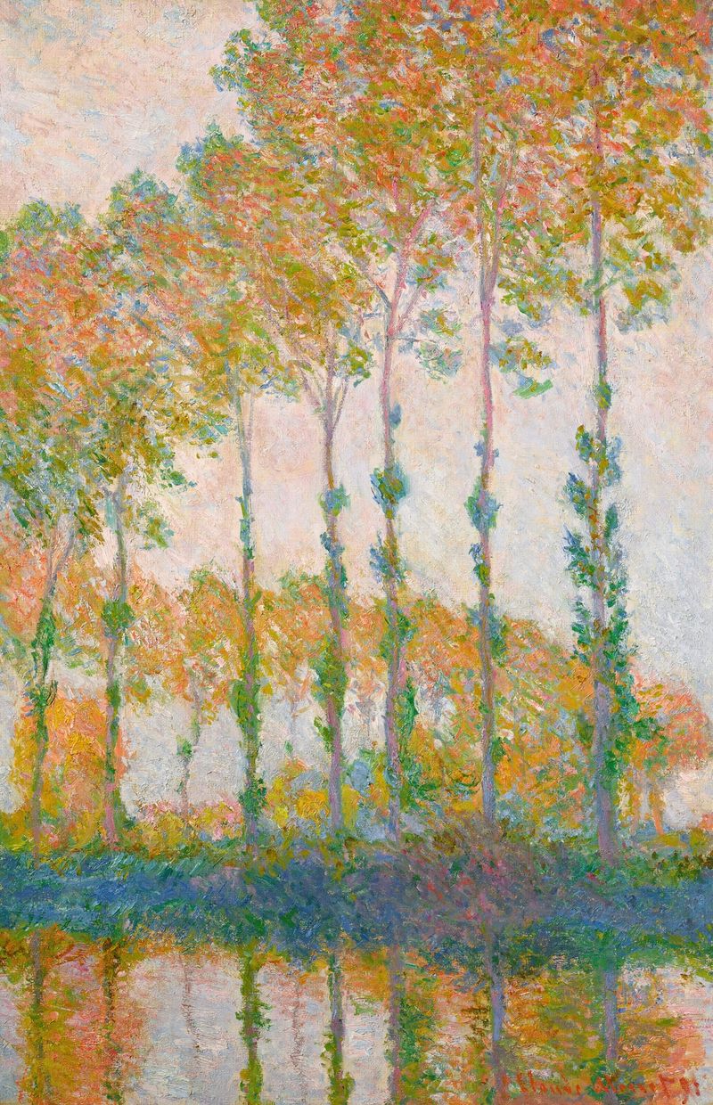 Peupliers au bord de l’Epte, automne de Claude Monet, óleo sobre lienzo que muestra álamos dorados y reflejos en el río