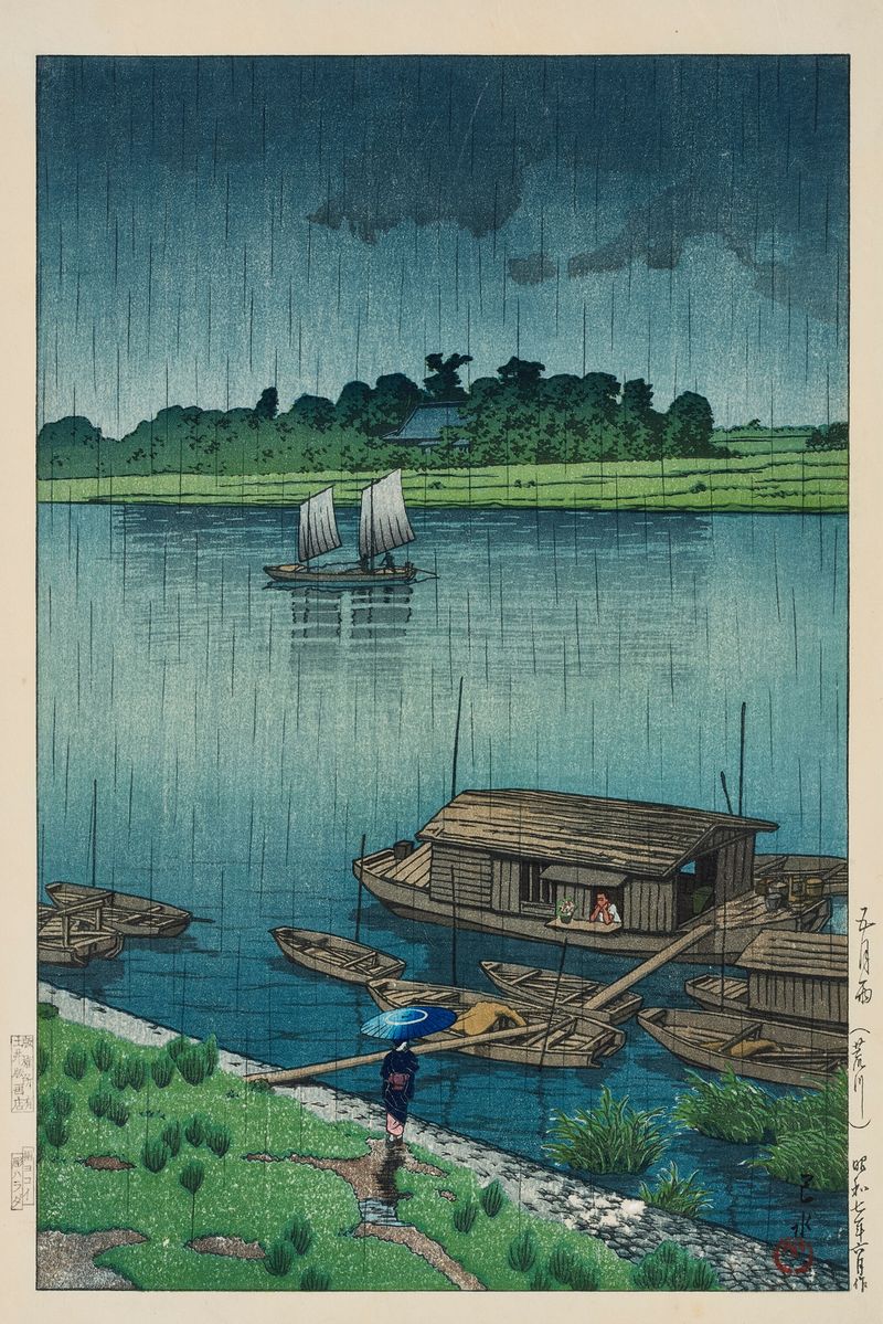 Impresión en madera de Kawase Hasui que muestra gotas de lluvia en hojas en un paisaje fluvial.