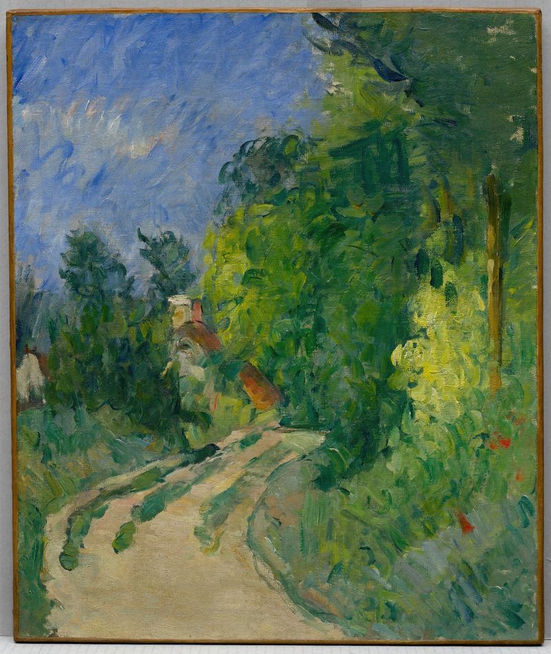 La Route tournante en sous-bois de Paul Cezanne, pintura al óleo que muestra un camino sinuoso entre el follaje.