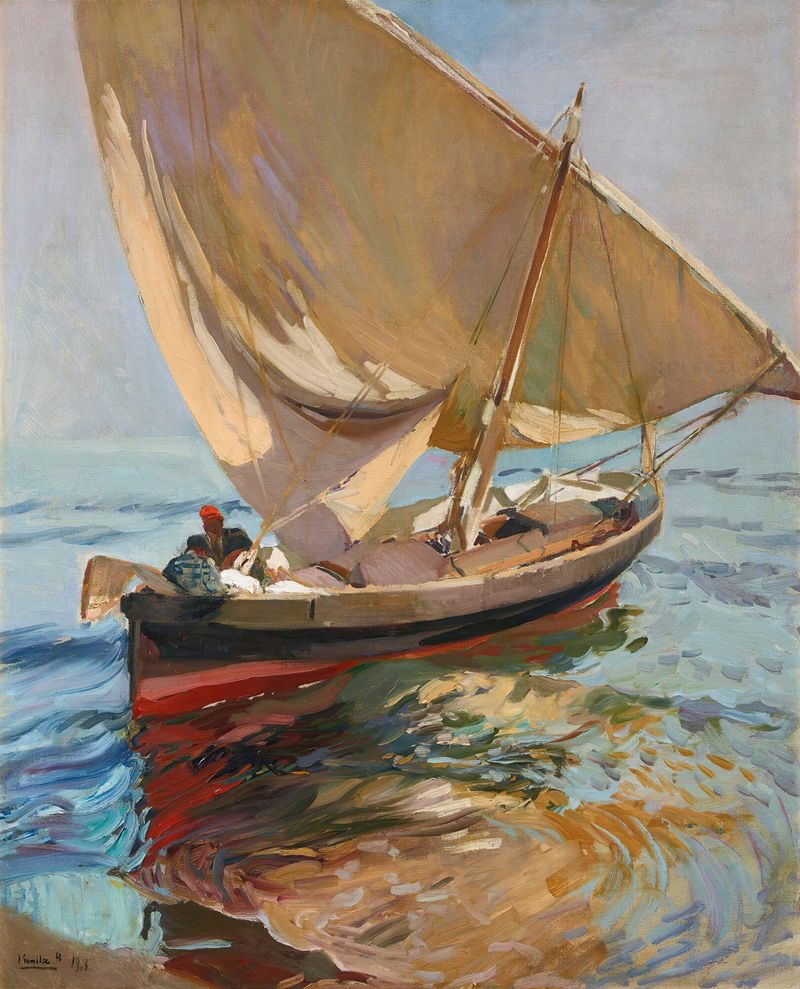 Fishermen preparing boats by the sea in an oil painting by Joaquín Sorolla