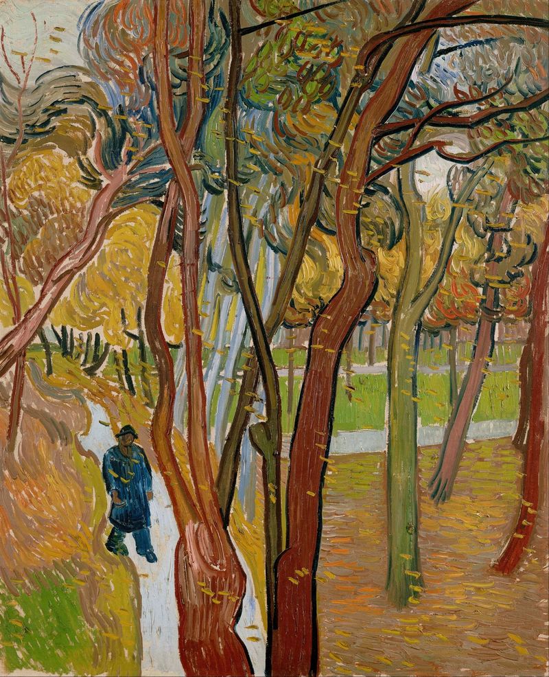 O jardim do Hospital de São Paulo de Vincent van Gogh, óleo sobre tela que retrata folhas de outono e uma figura.