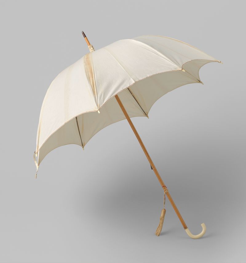Parasol crafted by Gustav Schnitzler, featuring ivory handle and intricate detailing.