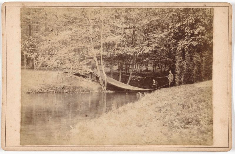 Garden landscape with a bridge over water, albumen print by J.S.J. de Jongh