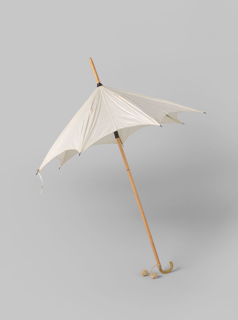 Parasol with white cotton cover on a light wooden stick by Gustav Schnitzler