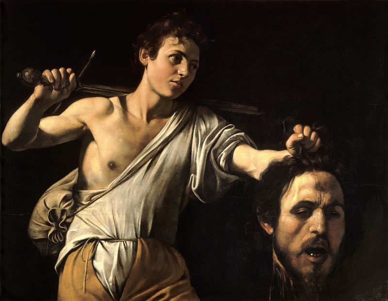 David holds Goliath's severed head in this oil painting by Caravaggio