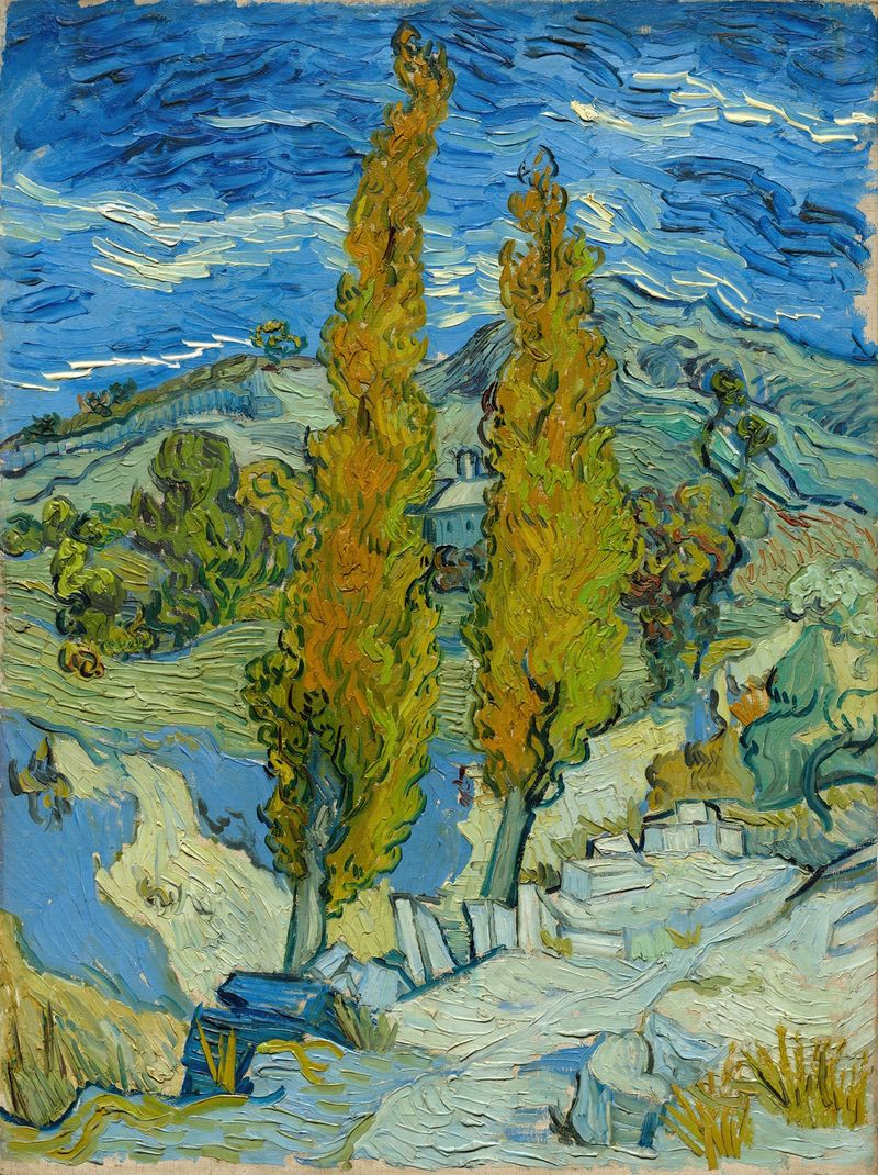 Dos Álamos en los Alpilles cerca de Saint-Rémy de Vincent van Gogh, óleo de árboles altos contra un cielo azul.