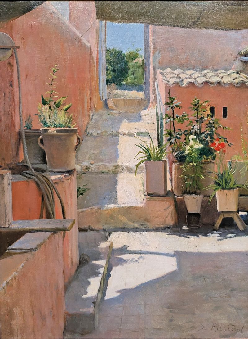 Patio in Sitges by Santiago Rusiñol, oil painting depicting a garden with terracotta tiles and lush foliage.