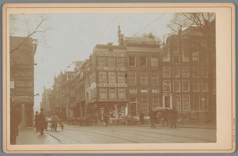Landscape photograph by Gebr. van R. showing Amsterdam street with sunlight and cobblestones.