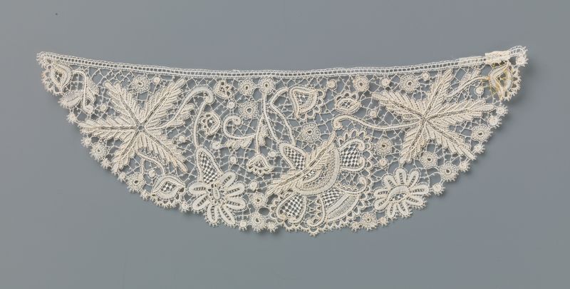 Lace textile by Martha Berkers featuring floral motifs and intricate design.