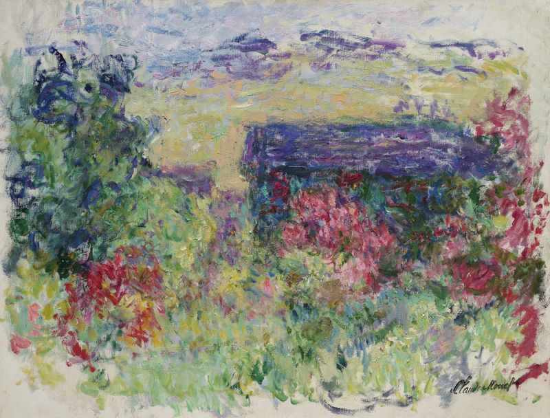 La Maison à travers les roses de Claude Monet, óleo sobre lienzo, que representa una casa rodeada de flores y luz.
