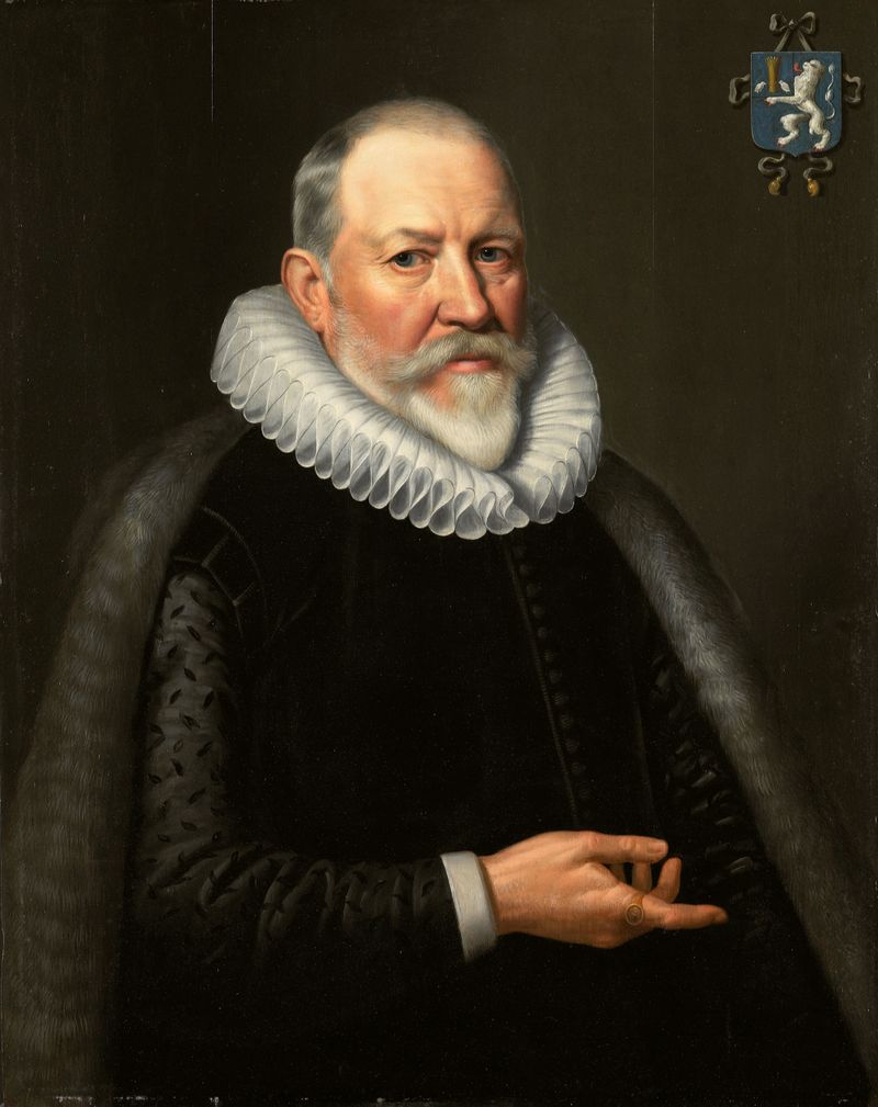 Portrait of a solemn man in rich fabrics with lace collar, oil on panel by Michiel Jansz van Mierevelt