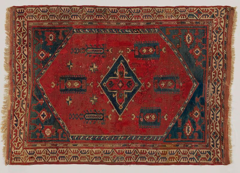 Oosters tapijt, tapiz de lana de c. 1700 con motivos geométricos y florales.