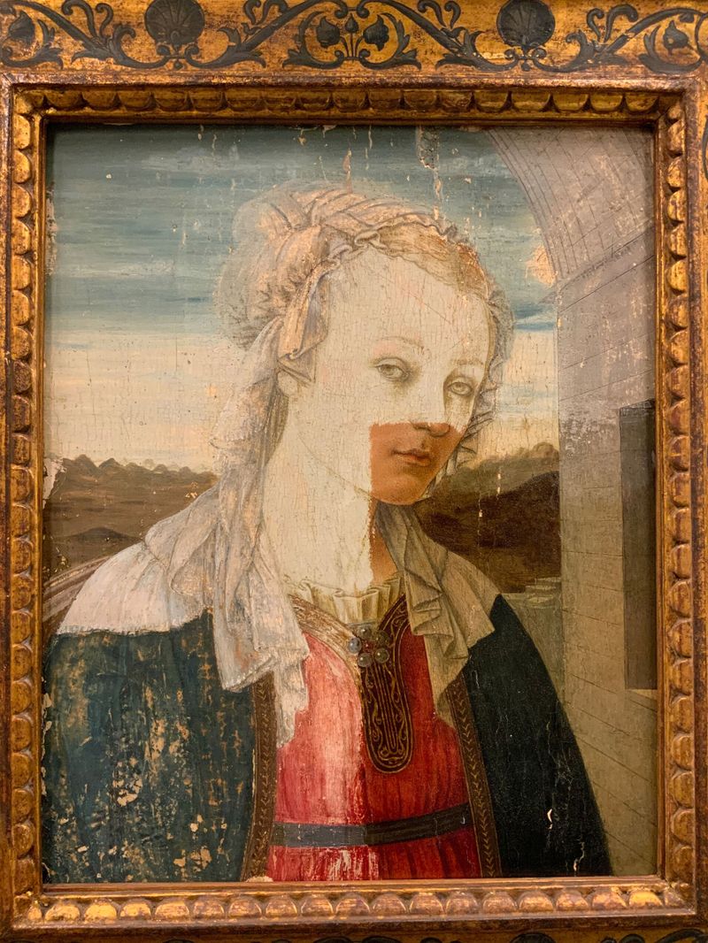 The Virgin Mary by Filippo Lippi, mixed media showing a serene figure with flowing drapery.