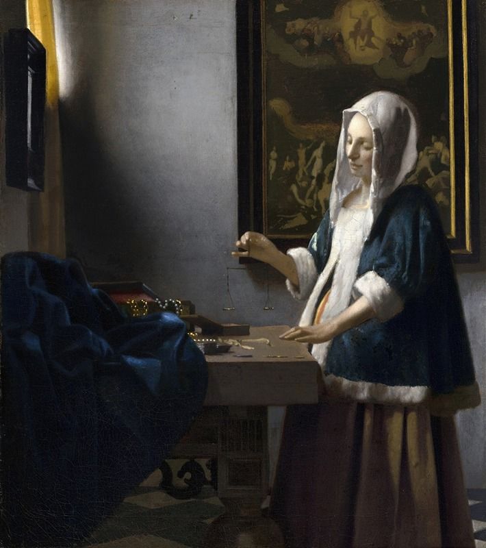 Woman holding a balance in an oil painting by Johannes Vermeer
