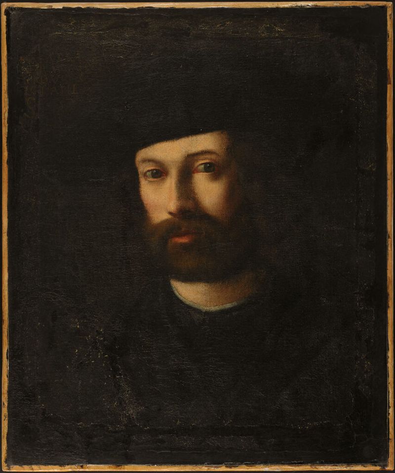 Retrato de um homem, óleo sobre tela de Giovanni Cariani, com expressão serena e detalhes intrincados.
