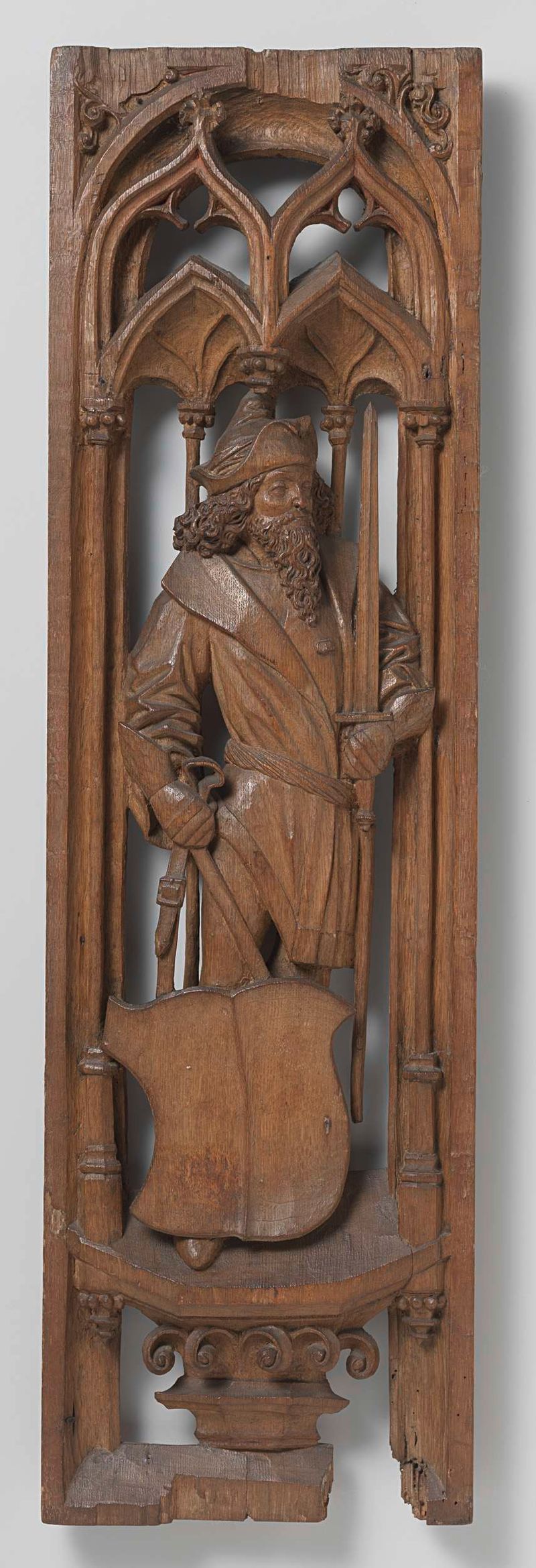 Panels from an organ case in oak by Jan Eerstensz van Schayck depicting figures with weapons