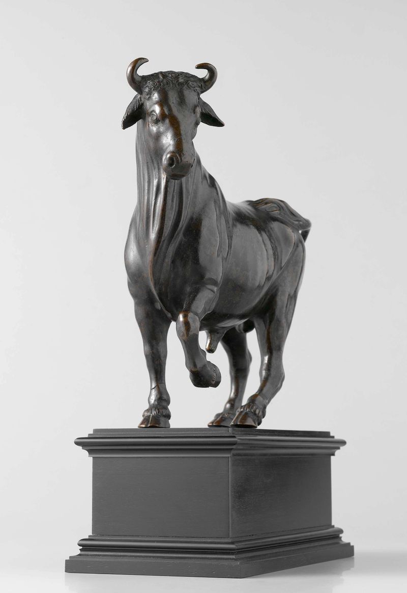 Bronze sculpture of a bull by Giambologna, showcasing muscular form.
