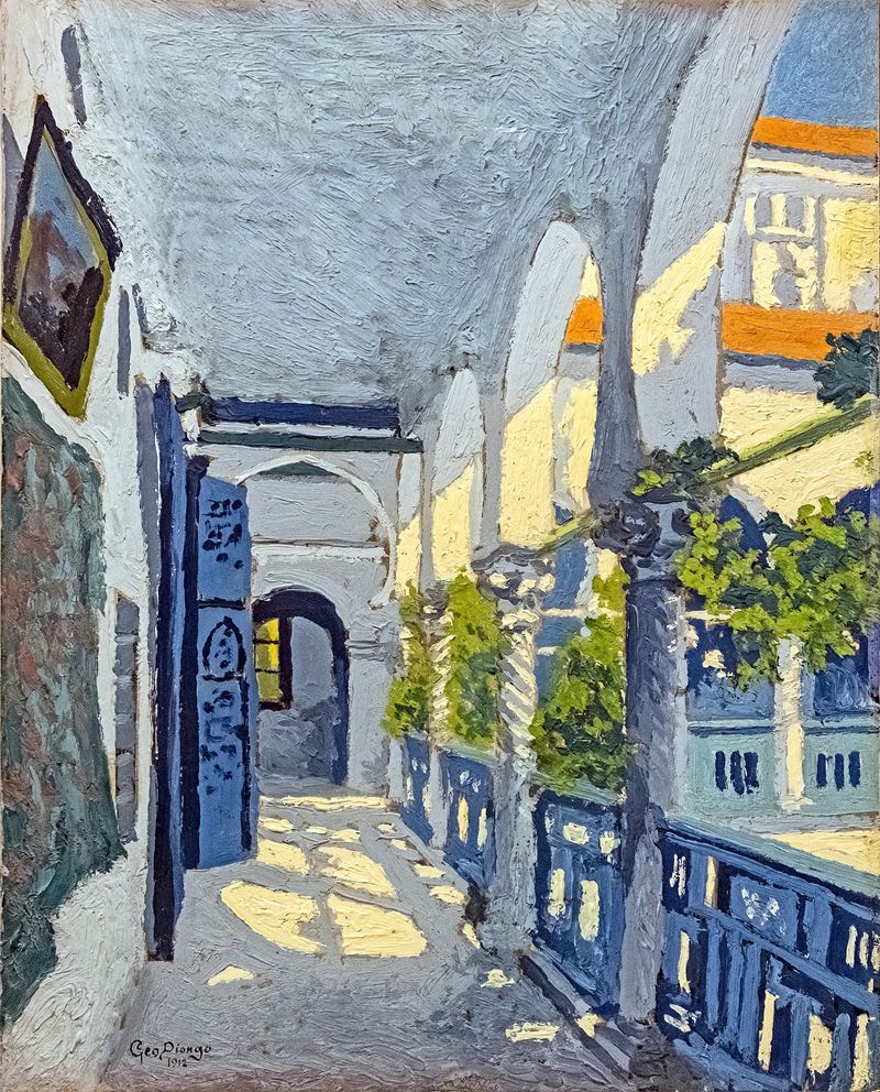 Courtyard of a Moroccan riad, featuring greenery and tiles, by Georges Gaudion.