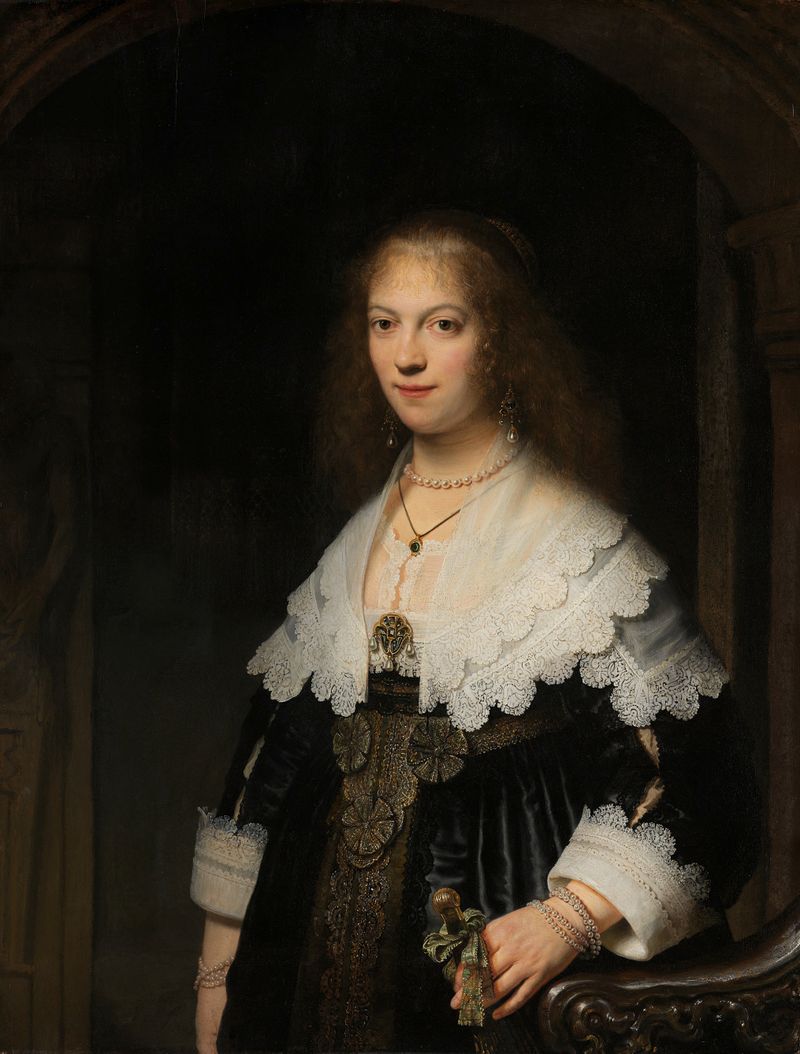Retrato de uma mulher segurando um leque, óleo sobre painel de Rembrandt van Rijn