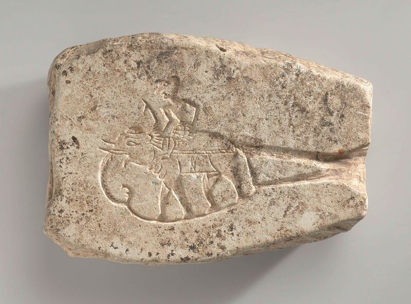 Relief sculpture of a man on an elephant and a woman on a makara, stone, Unknown Artist